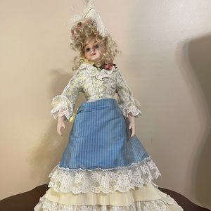 Antique porcelain doll with stand